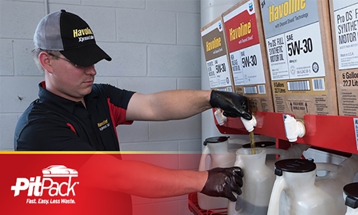 Man pouring oil from  pitpack rack