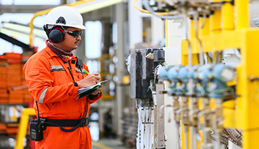 man doing  maintenance on equipment