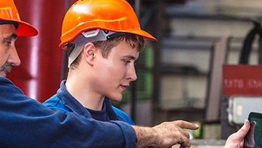 Men looking at computer screen